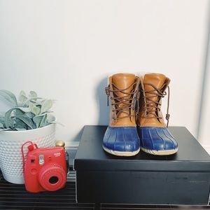 Brown and blue duck boots